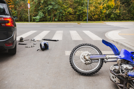 fallen Bike and car in walkway