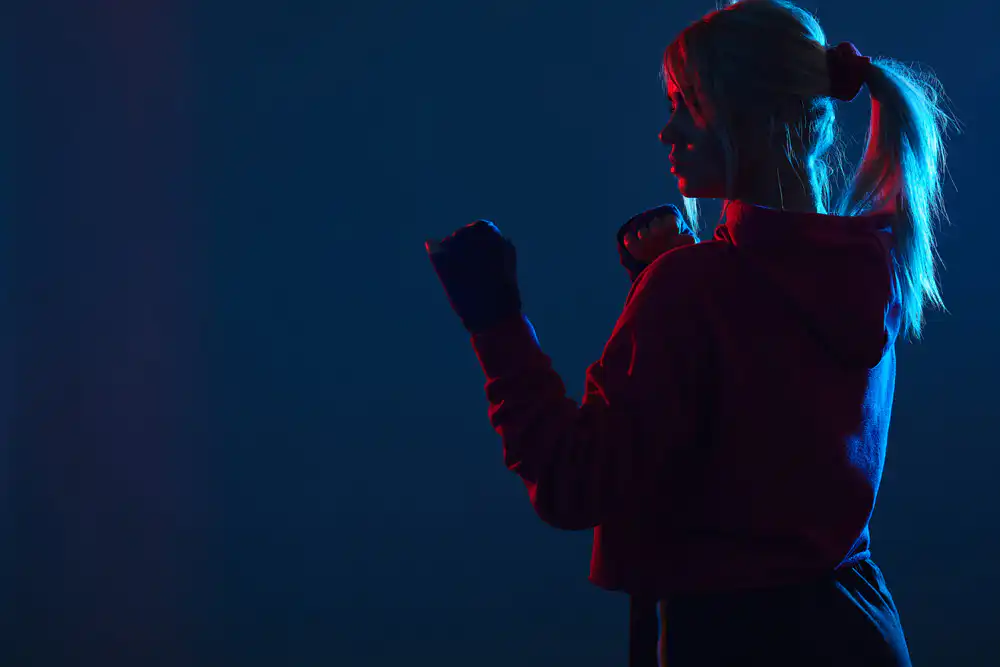 Female standing in a self-defensive stance